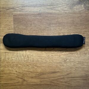 Black beaded wrist rest.